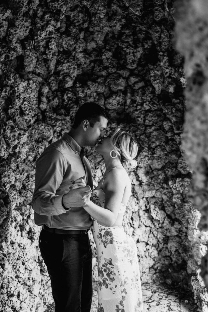 a couple kisses inside of a cave in Miami at Vizcaya wedding venue
