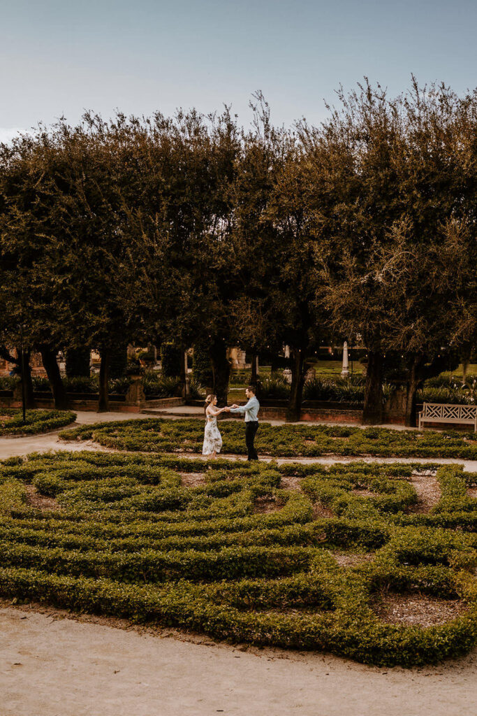 a couple kisses in the middle of the vazt Vizcaya gardens