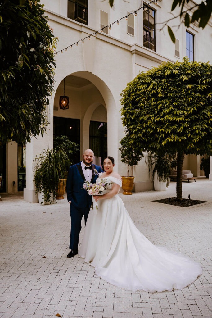 a bride and groom posing for their portraits at the Thesis Hotel in Miami
