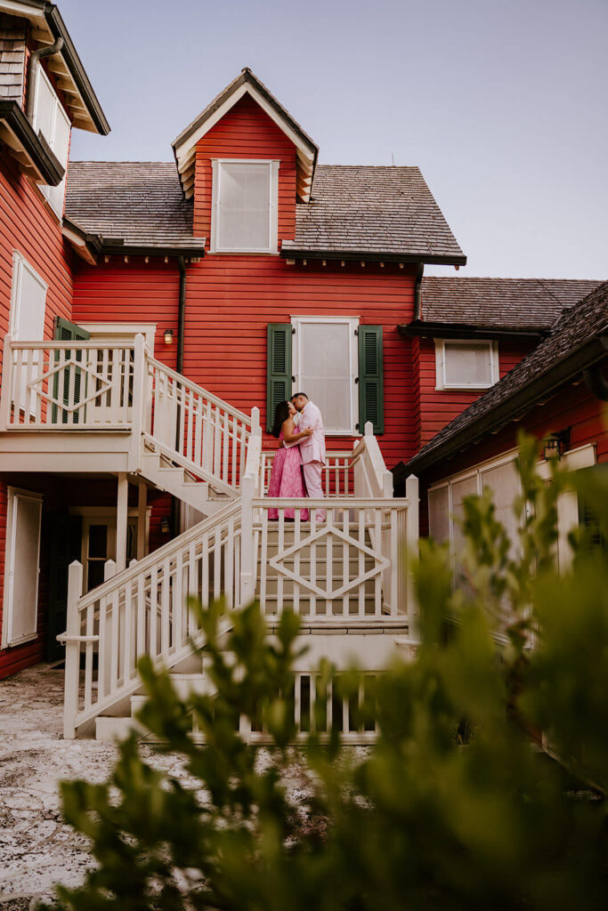 a bride in a pink dress posing with her groom on their wedding day in Miami florida