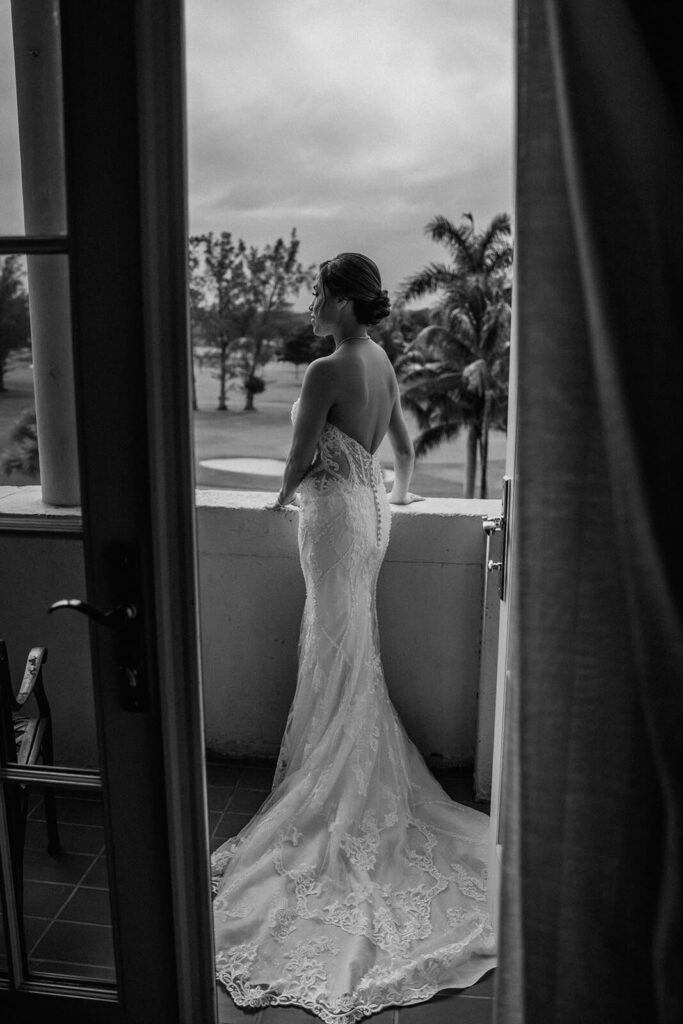 a bride overlooks the grounds at the luxury venue Biltmore Hotel in Miami 