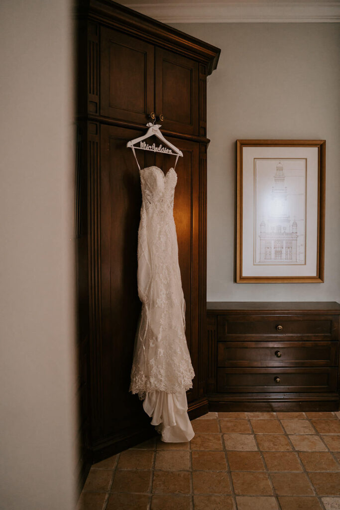a wedding dress hanging on a wardrobe in the Biltmore Hotel in Miami