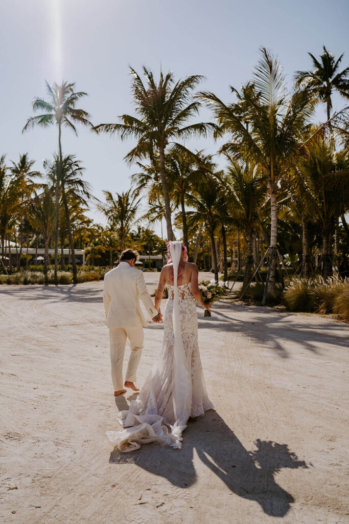 a couple walks away after their islamorada ceremony at their springtime wedding