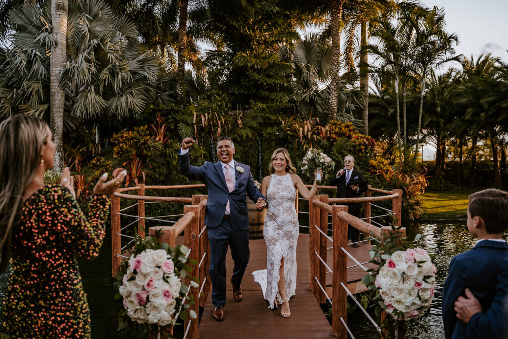 a couple exits their ceremony space after being announced husband and wife