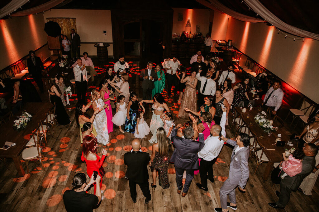 a birds eye view of all the guests dancing at a wedding reception in homestead florida