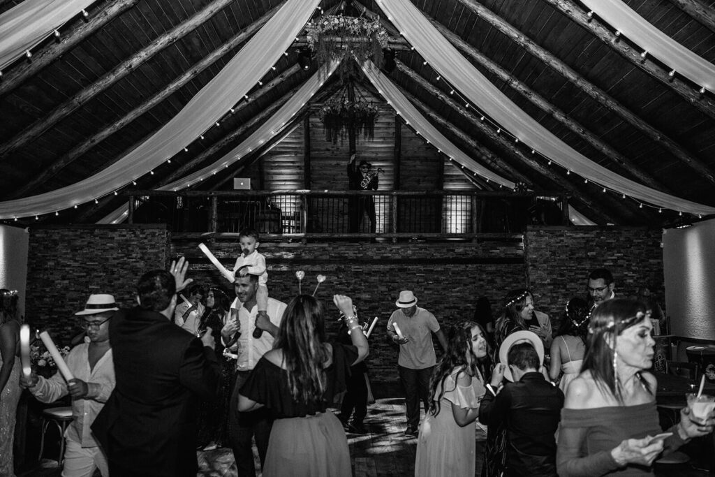guests dancing at a wedding reception at longans place