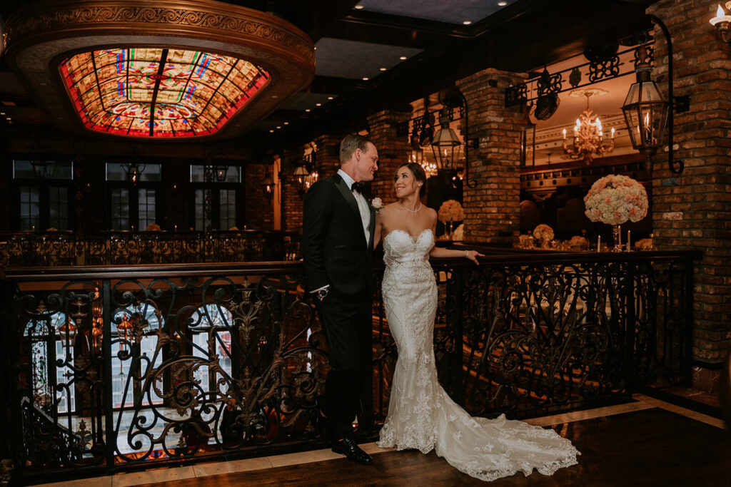 a couple posing for their wedding photos at The Cruz Building in Coconut Grove, Miami.