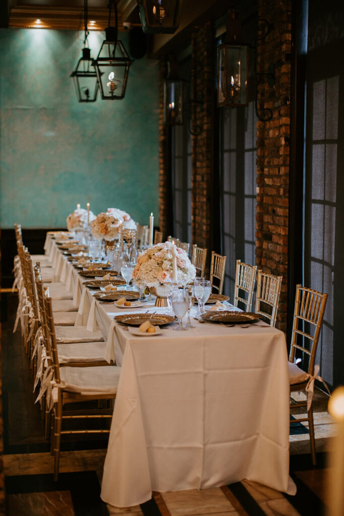a beautiful reception table set up for a wedding dinner at the Cruz Building 
