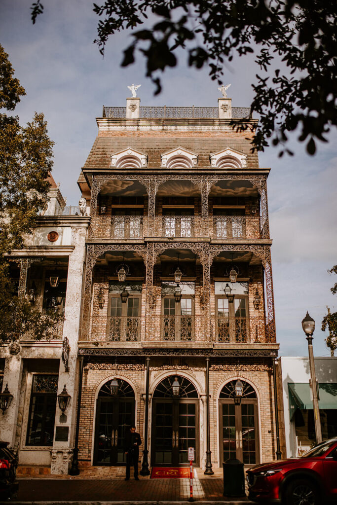 the outside of a coconut grove wedding venue in miami called the cruz building