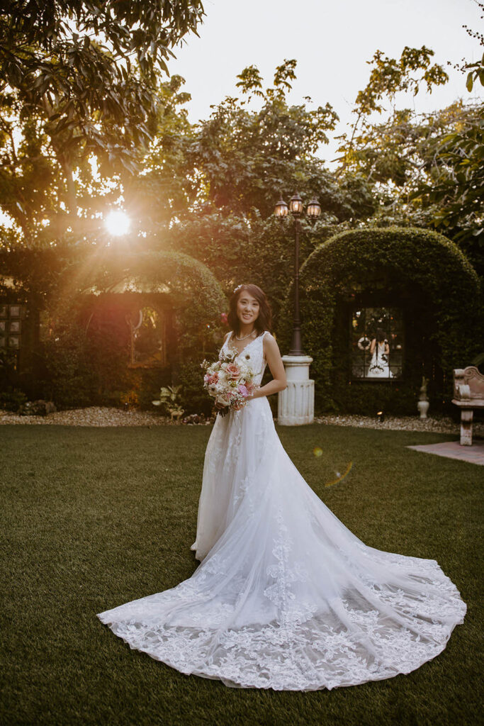 a bride poses with the sunset behind her at her miami wedding at Villa Tosacana