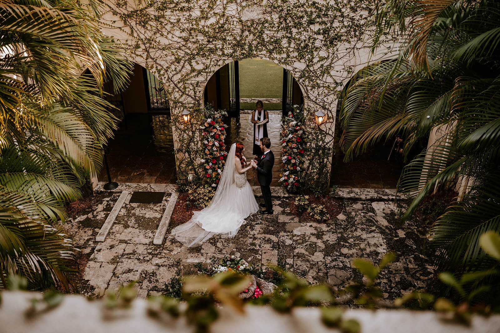 a bride and a groom at their ceremony at Villa Woodbine in Miami