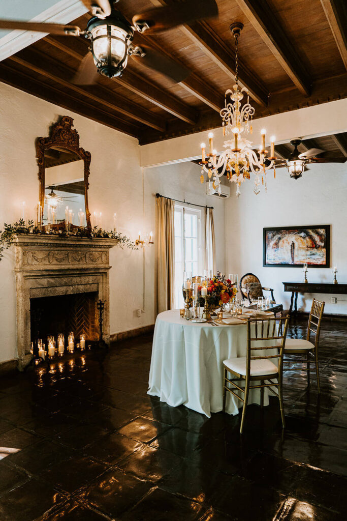 a beautiful dinner set up for a couple on their wedding day inside one of the rooms at Villa Woodbine in Miami