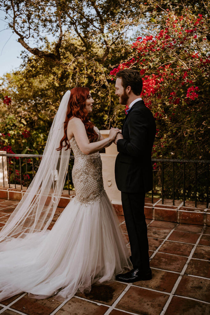 a couple dances on the balcony of their wedding venue