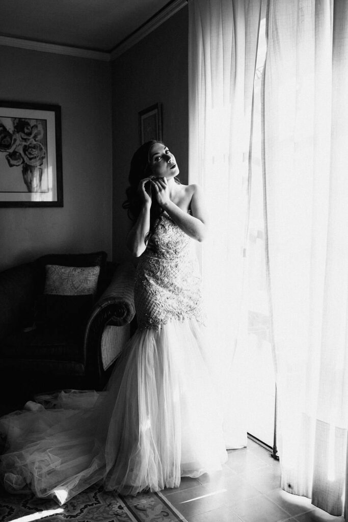 a bride gets ready in the bridal suite at Vila Woodbine in Miami Florida