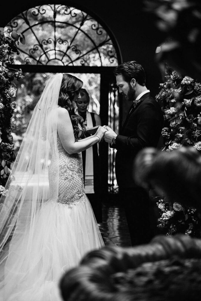 a couple holds hands during their ceremony at Villa Woodbine in Miami