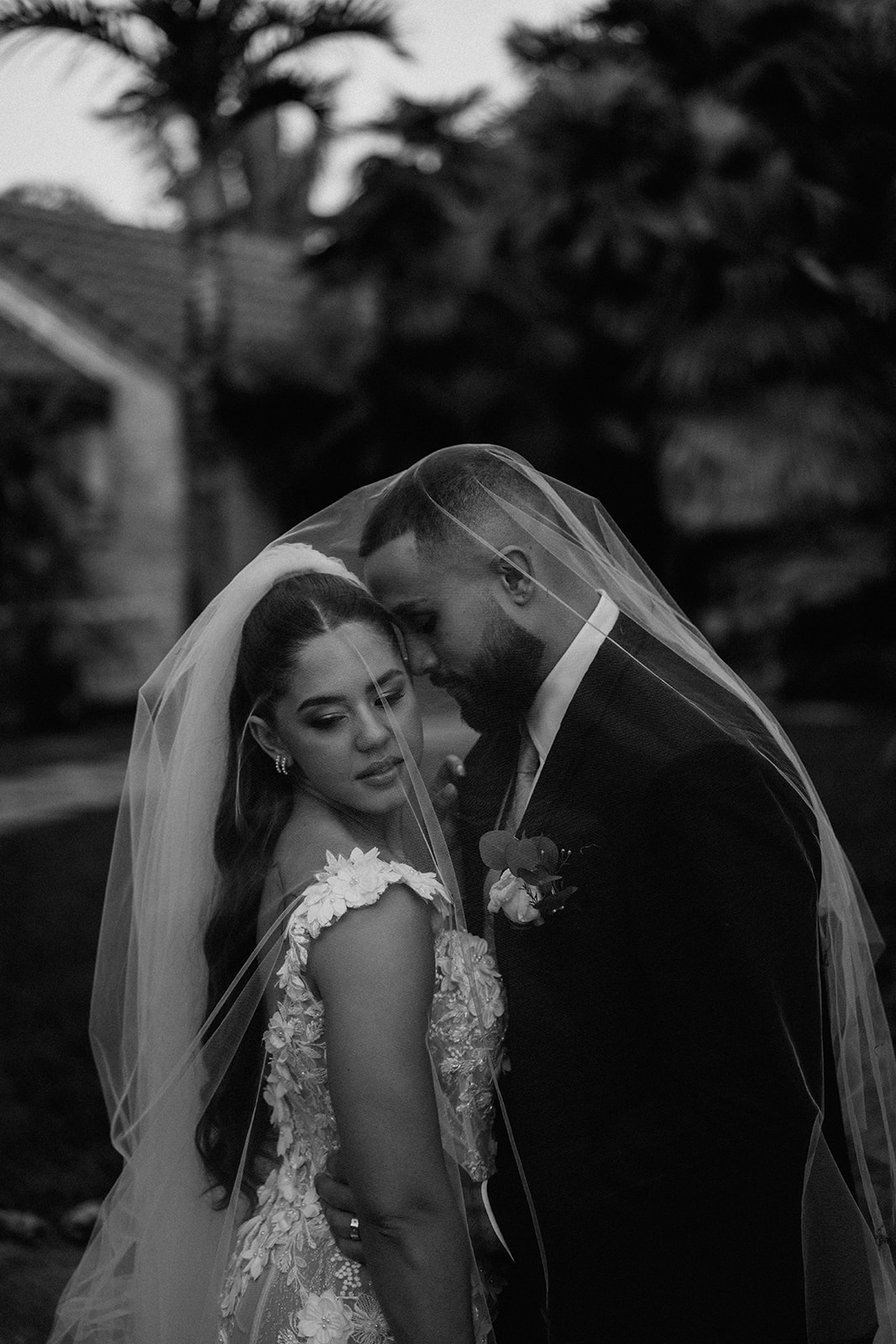 Bride and groom under bride's veil at their Cooper Estate wedding