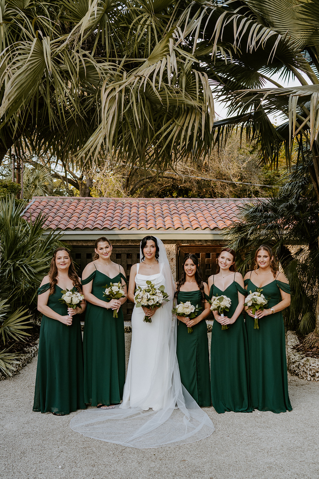 Bridesmaids in green dresses at The Copper Estate