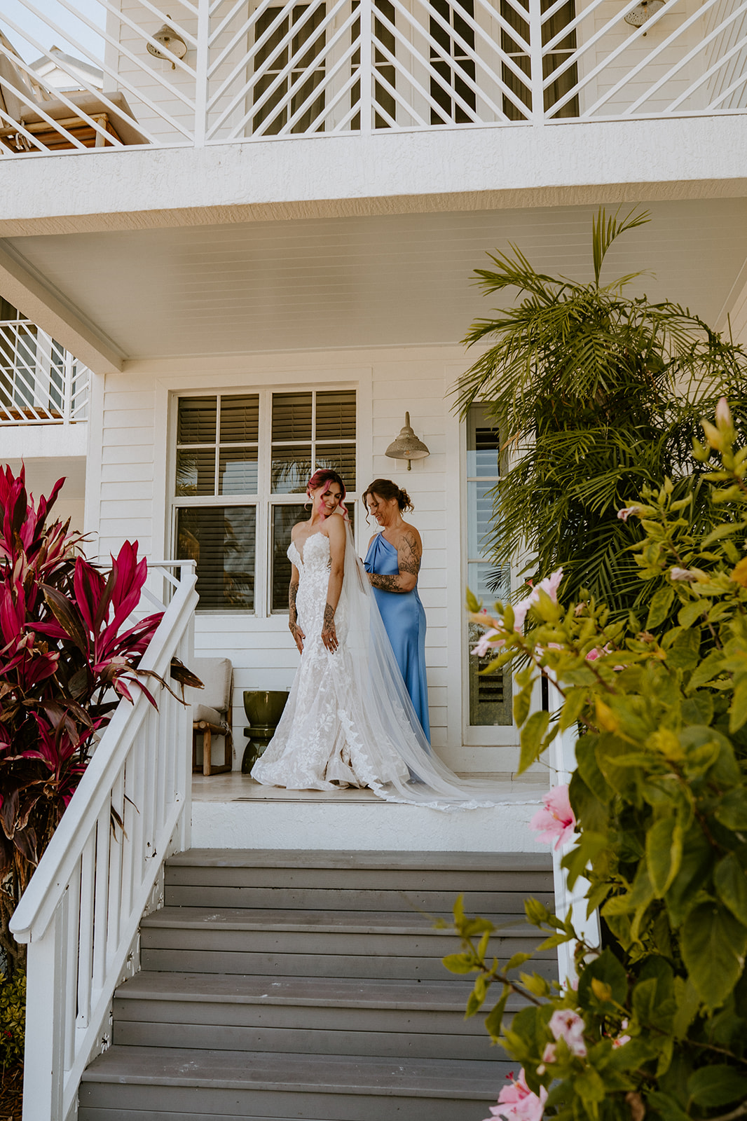 Bride getting into wedding dress