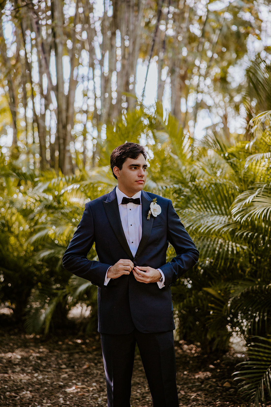 Groom buttons jacket at the Cooper Estate