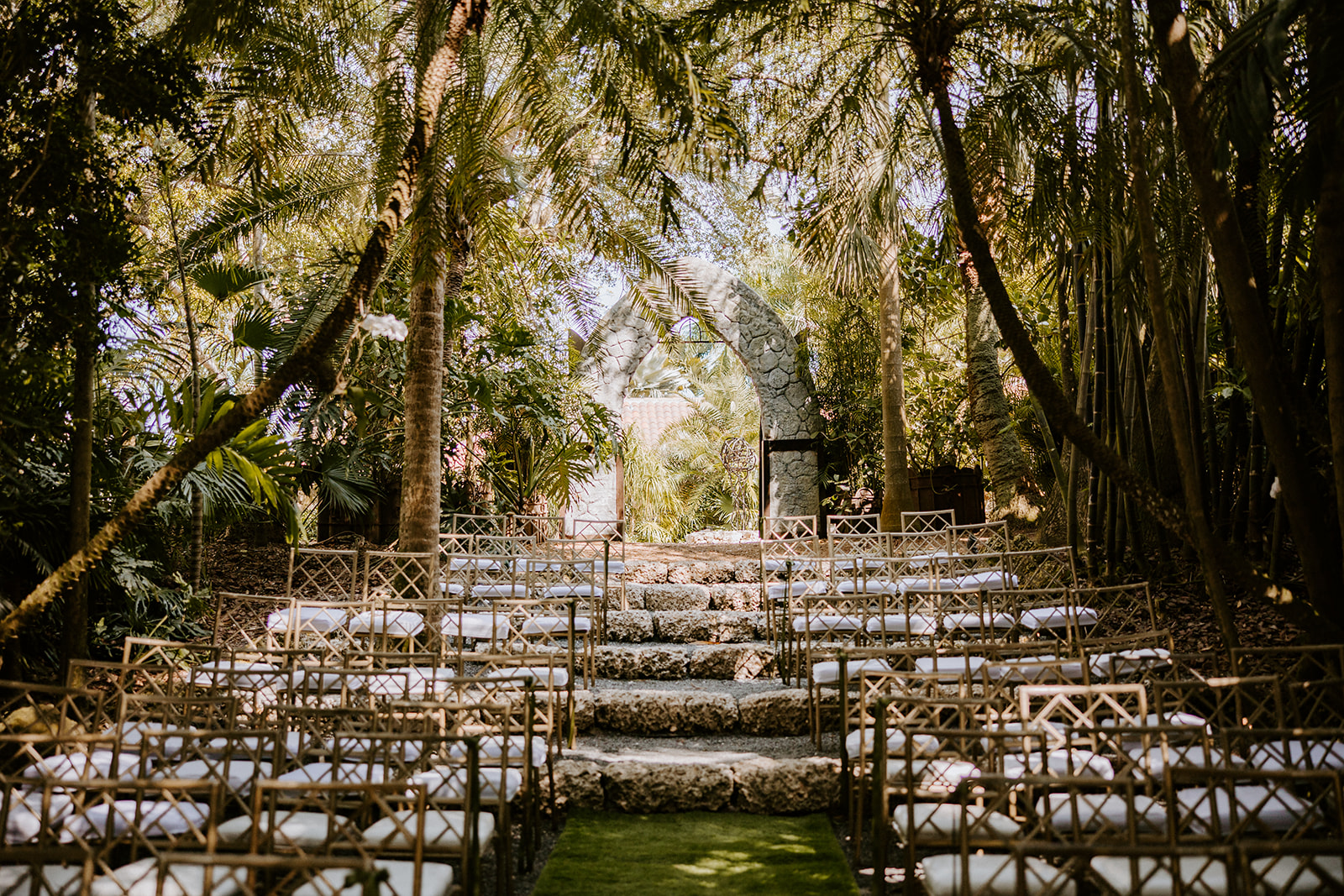 Gold chairs set up in the garden at the Cooper Estate
