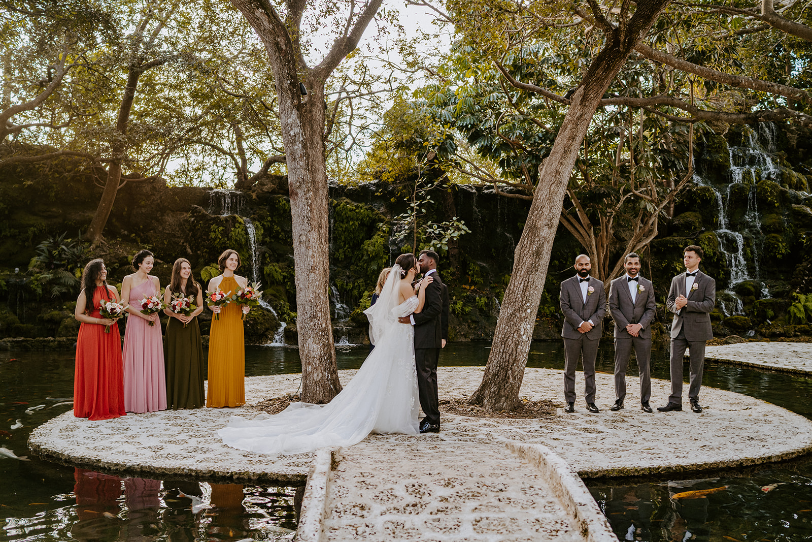 Bride and groom kiss at their Miami wedding ceremony