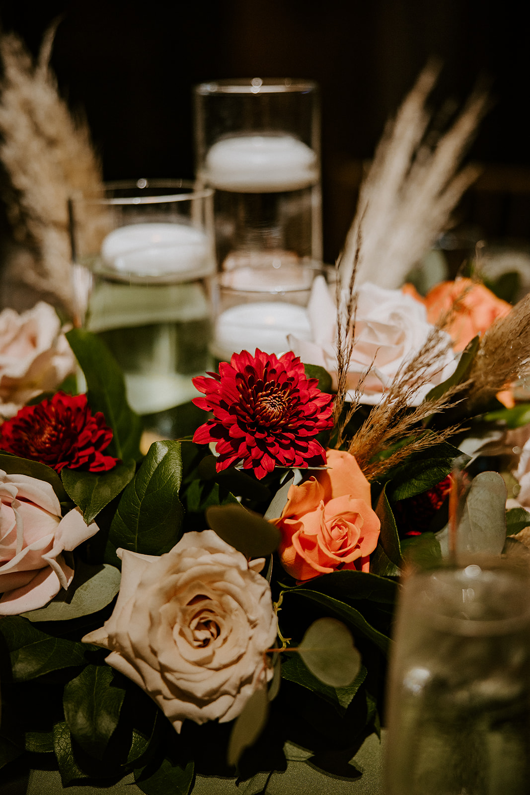 Red and peach flowers at the Miami wedding reception