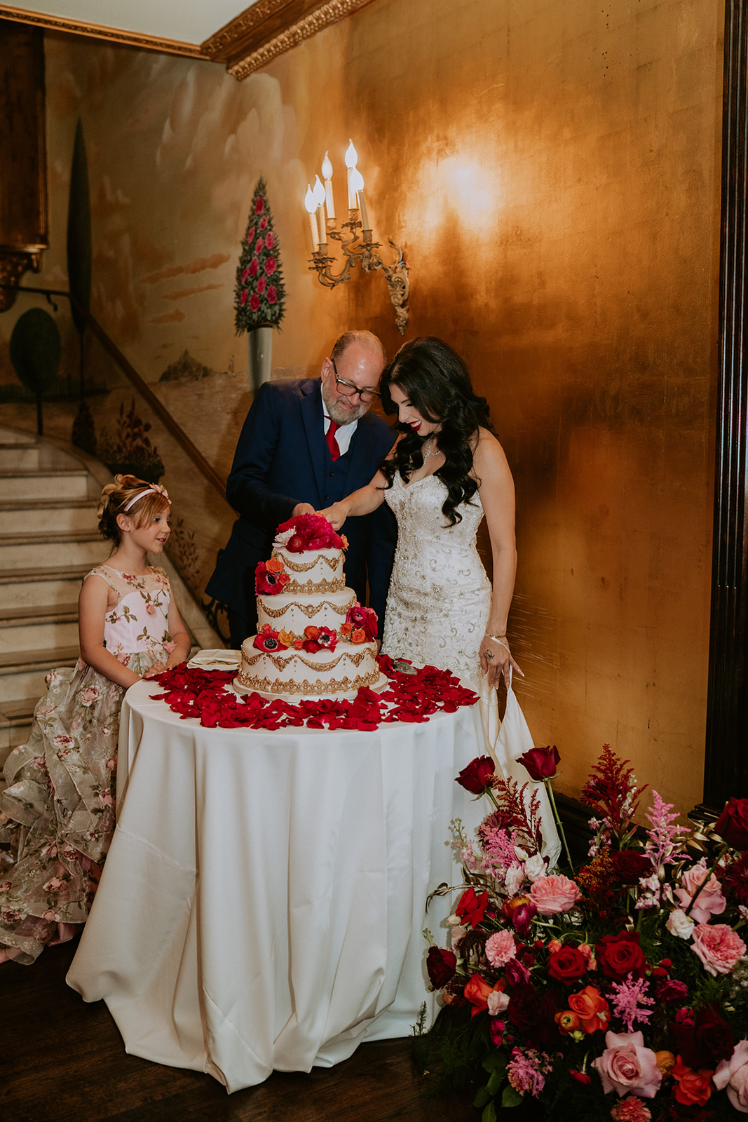 Bride and groom cut cake at the Cruz Building wedding