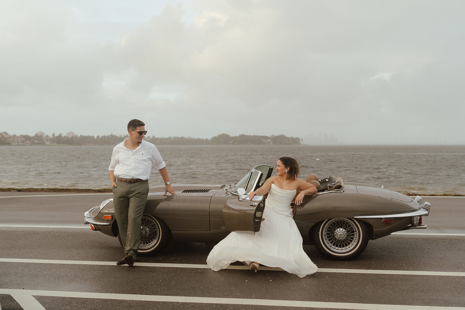 Couple with vintage car during their Miami engagement session