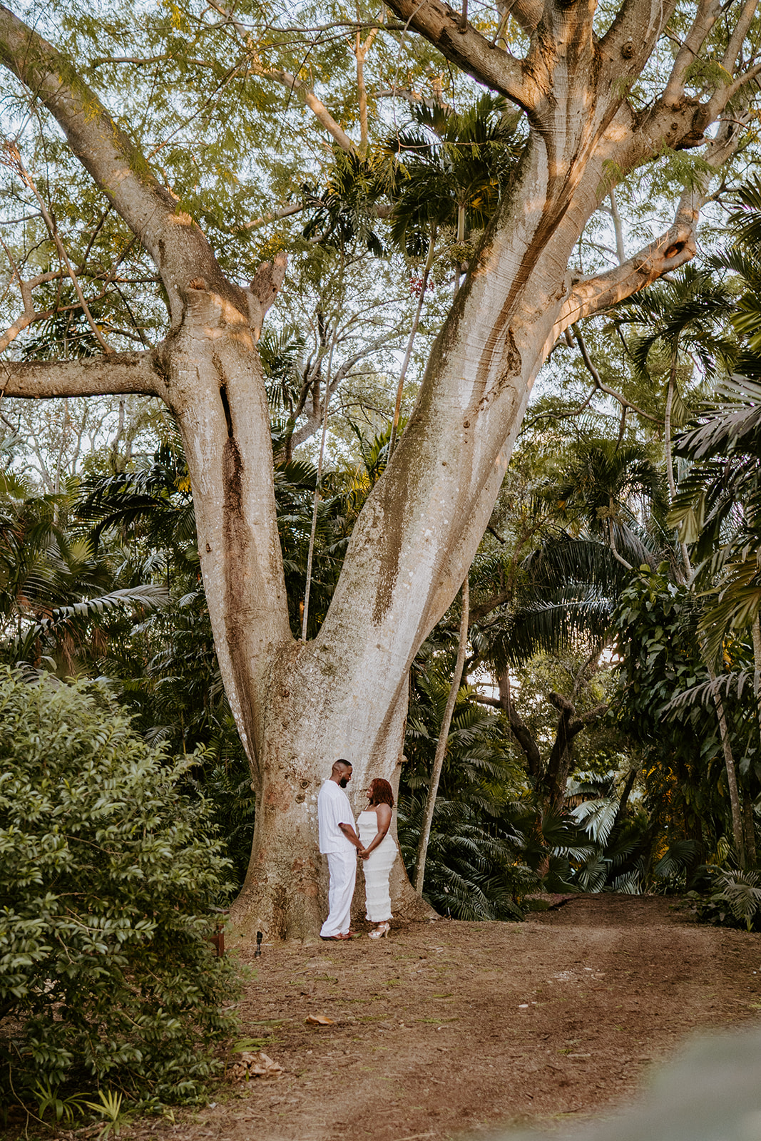 Couple holds hands at Fairchild Tropical Botanic Garden engagement photos