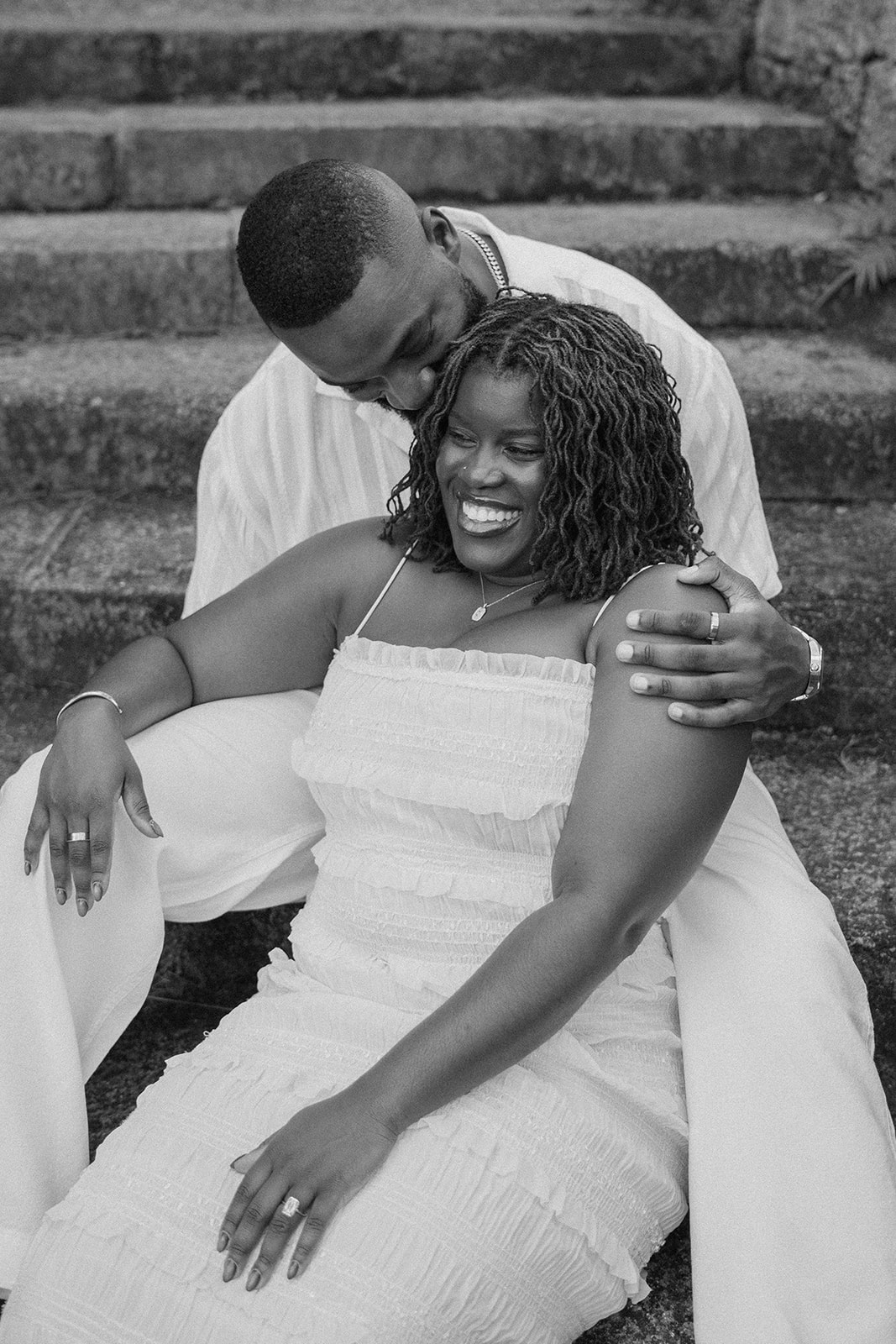 Man kisses woman at their Fairchild Tropical Botanic Garden engagement photos