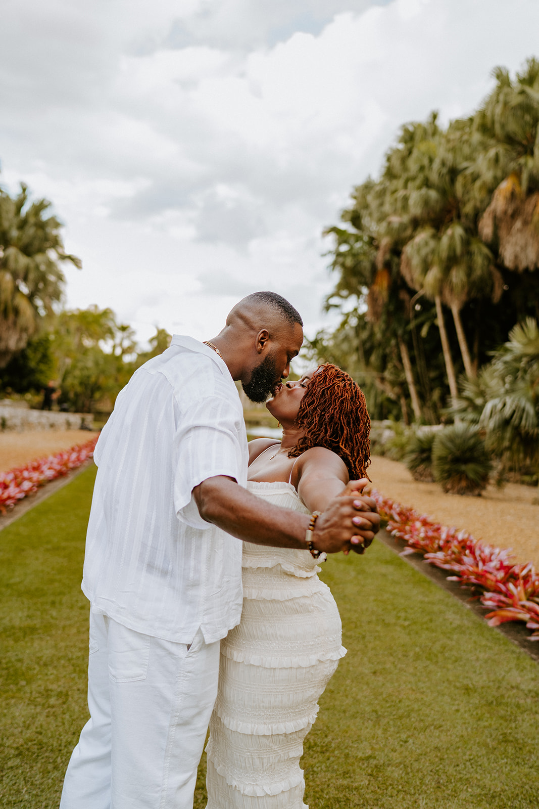 Couple kisses at Fairchild Tropical Botanic Garden