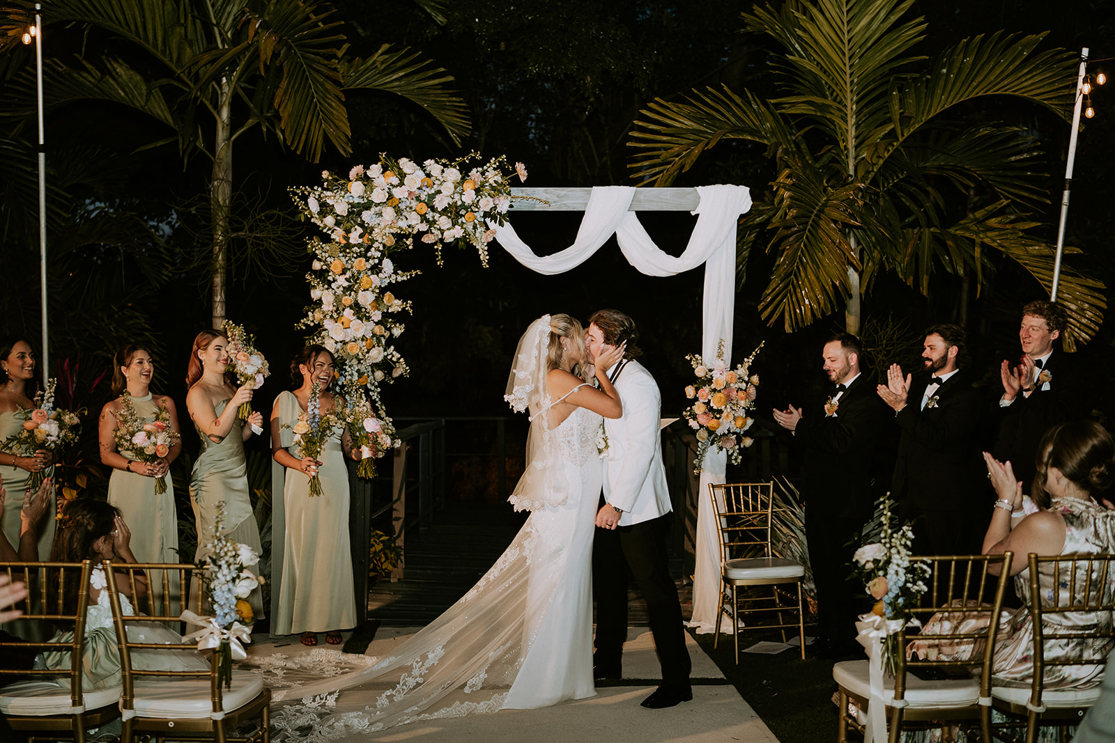 Bride and groom kiss at the Vignette Gardens wedding