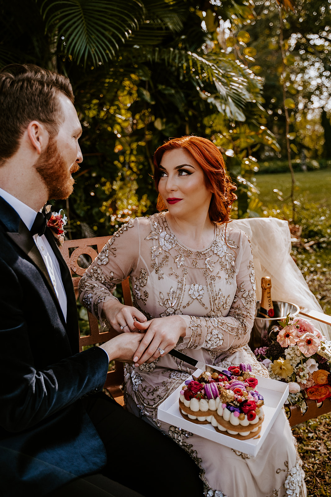 Bride and groom cut their cake at the Ancient Spanish Monastery wedding