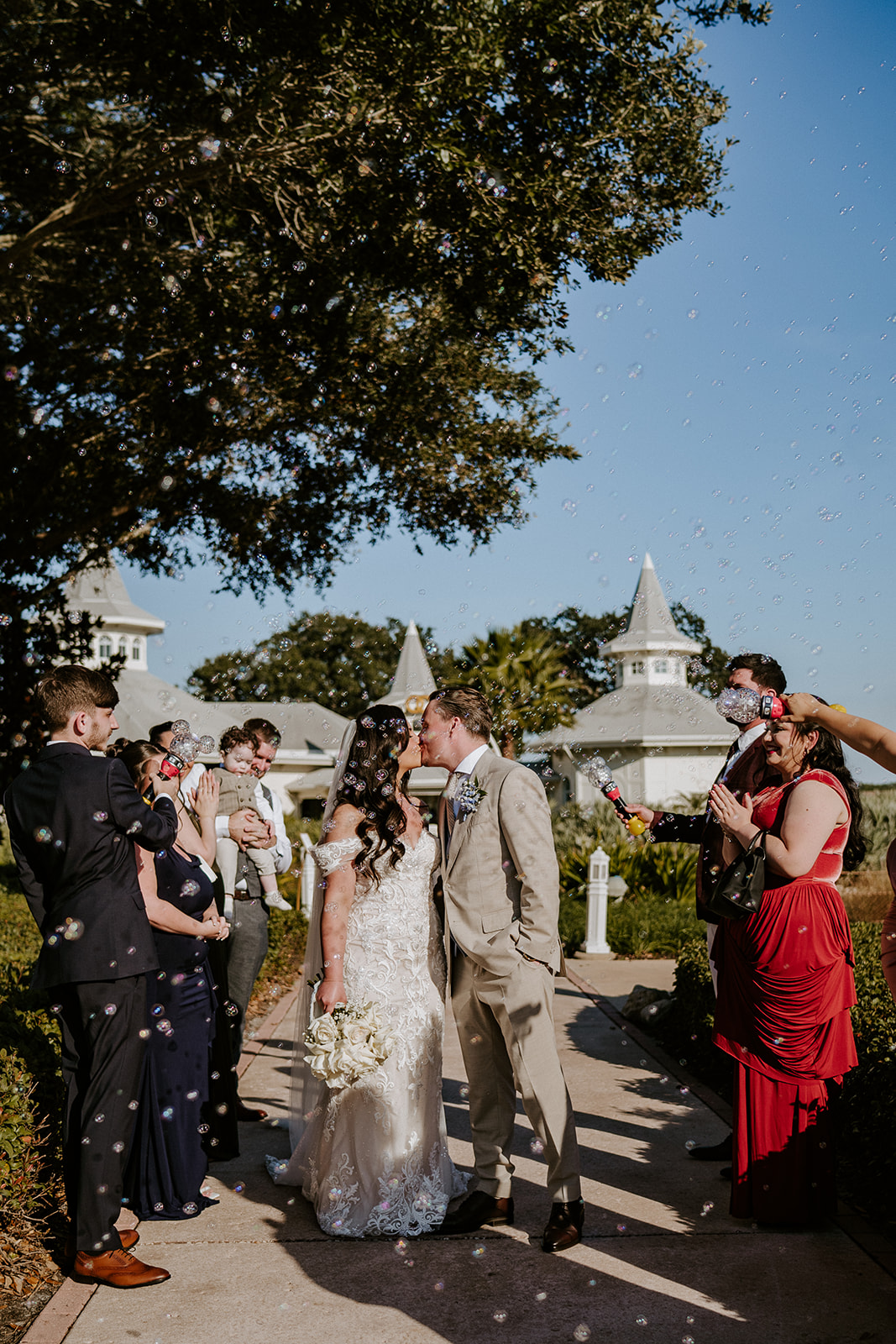 Bride and groom kiss at their Walt Disney World wedding