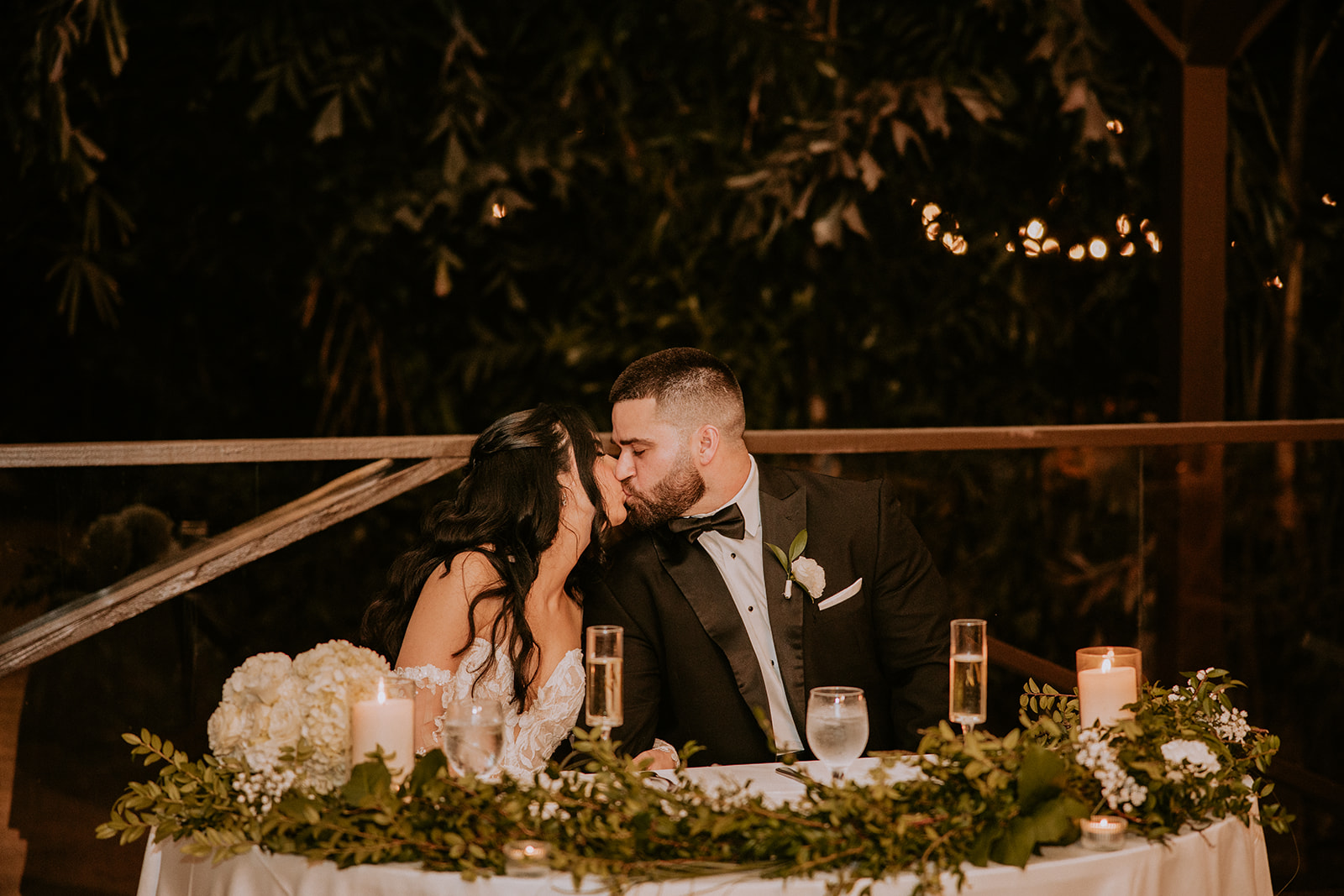 Couple kisses at their Gardens of Weber Manor wedding
